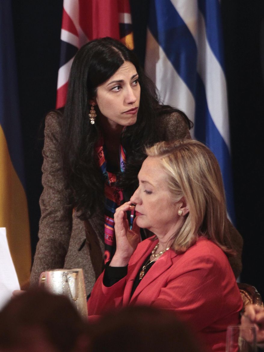 Huma Abedin, deputy chief of staff and aide to Secretary of State Hillary Rodham Clinton, wife of former New York Rep. Anthony Weiner, rear, is seen during the Open Government Partnership meeting in New York, Tuesday, Sept., 20, 2011. (AP Photo/Pablo Martinez Monsivais)