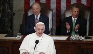 Pope Francis addresses a joint meeting of Congress on Capitol Hill in Washington, Thursday, Sept. 24, 2015, making history as the first pontiff to do so. Listening behind the pope are Vice President Joe Biden and House Speaker John Boehner of Ohio. (AP Photo/Carolyn Kaster)