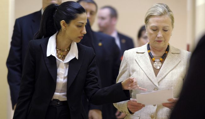 Hillary Rodham Clinton personally signed the controversial deal in 2012 that let her top aide Huma Abedin simultaneously work for the State Department and a private New York firm with deep ties to the Clinton family, according to records made public Thursday. (Associated Press)