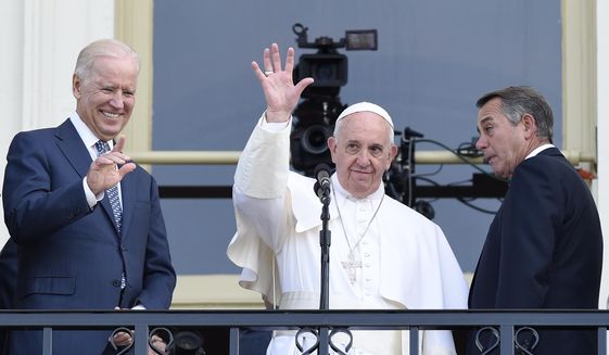 Pope Francis, flanked by Vice President Joe Biden and House Speaker John Boehner of Ohio, waves to the crowd on Capitol Hill in Washington, Thursday, Sept. 24, 2015, as they stand on the Speaker&#39;s Balcony on Capitol Hill, after the pope addressed a joint meeting of Congress inside. (AP Photo/Susan Walsh)