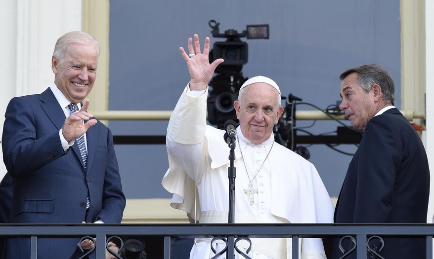 Pope Francis, flanked by Vice President Joe Biden and House Speaker John Boehner of Ohio, waves to the crowd on Capitol Hill in Washington, Thursday, Sept. 24, 2015, as they stand on the Speaker&#x27;s Balcony on Capitol Hill, after the pope addressed a joint meeting of Congress inside. (AP Photo/Susan Walsh)