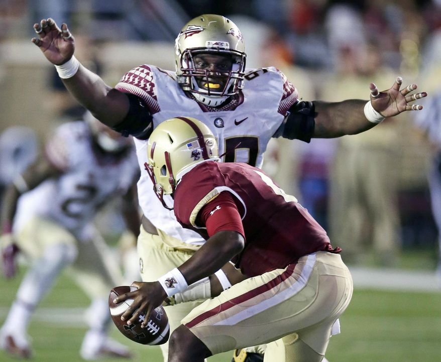 FILE - In this Sept. 18, 2015, file photo, Florida State defensive tackle Nile Lawrence-Stample tracks down Boston College quarterback Darius Wade on a sack during the second half of an NCAA college football game in Boston. Florida State's bye week might be coming at a good time. The defense is playing well but lack of consistency on offense has been a problem for the No. 10 Seminoles. (AP Photo/Charles Krupa, File)