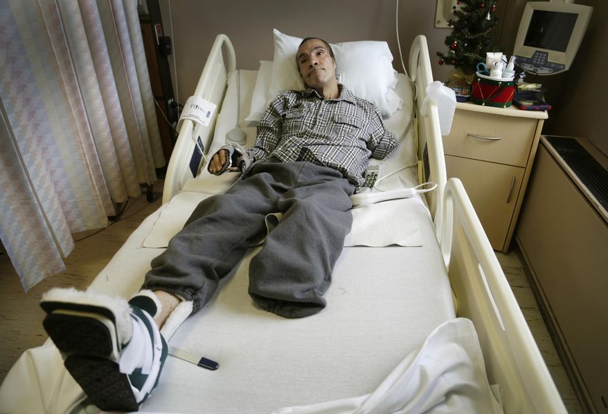 FILE--In this Dec. 9, 2014 file photo, Steve Constantine, who suffered a near fatal dog mauling in October of 2014 is shown in a hospital bed in Detroit. Derick Felton, a Detroit dog owner who pleaded guilty in the brutal mauling of a man who was attacked while feeding a pack of pit bulls, faces sentencing Friday, Sept. 24, 2015. Constantine lost most of his left arm, his left leg below the knee and his left ear last fall. (Mandi Wright/Detroit Free Press via AP) DETROIT NEWS OUT; TV OUT; MAGS OUT; NO SALES; MANDATORY CREDIT DETROIT FREE PRESS