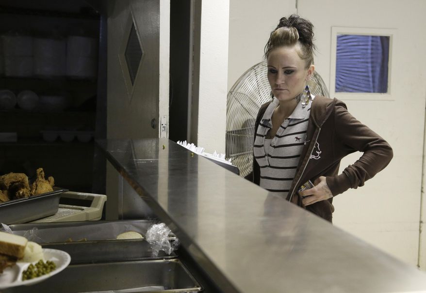 In this Tuesday, Oct. 22, 2013 photo, Faye Medema waits for food at a cafeteria in a recovery center in Houston. She says she was ready to go back to school and get a job, ready to try to regain custody of her young son after being jailed on child endangerment charges one night when she was high. (AP Photo/Pat Sullivan)