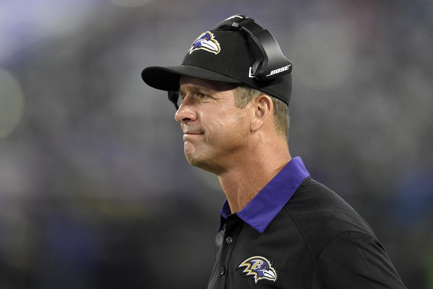 FILE - In this Aug. 29, 2015, file photo, Baltimore Ravens head coach John Harbaugh watches from the sideline in the second half of a preseason NFL football game against the Washington Redskins in Baltimore. USA Football's successful program teaching the proper fundamentals for tackling _ Heads Up Football gets the head out of the hit _ is making a difference throughout the youth leagues across America. Yet when those kids watch games on Sunday, what they're seeing sure isn't what they're being taught. "It's two-fold usually with missed tackles," Ravens coach John Harbaugh said. "It's definitely technique. Sometimes, in a sense, you're not aggressive enough. (AP Photo/Nick Wass, File)