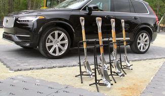 A Volvo and shovels are displayed at the groundbreaking for Volvo&#39;s first auto assembly plant in North America, Friday, Sept. 25, 2015, near Ridgeville, S.C. (AP Photo/Bruce Smith) ** FILE **