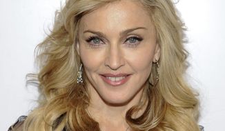 This April 12, 2012, file photo shows singer Madonna arriving at Macy&#39;s Herald Square to launch her new fragrance in New York. (AP Photo/Evan Agostini, File)