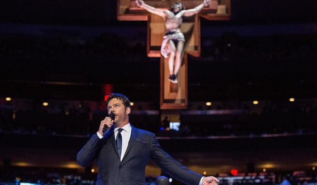 Harry Connick Jr. sings &amp;quot;How Great Thou Art&amp;quot; prior to a Mass led by Pope Francis at Madison Square Garden Friday, Sept. 25, 2015 in New York. Pope Francis is visiting New York City during a six-day tour of the United States, with stops in Washington D.C., New York City and Philadelphia.  (Andrew Burton/Pool Photo via AP)