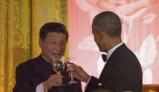 Chinese President Xi Jinping and President Obama toast during a state dinner Friday at the White House. (AP Photo)