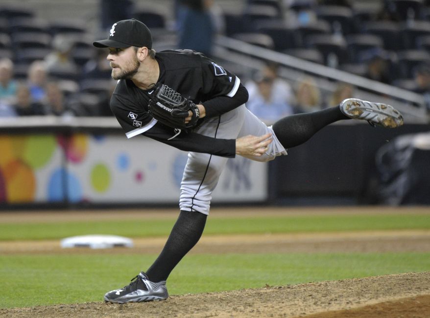 Chicago White Sox closer David Robertson delivers the ball to the New York Yankees during the ninth inning of a baseball game Friday, Sept. 25, 2015, at Yankee Stadium in New York. Robertson got the save as the White Sox defeated the Yankees 5-2. (AP Photo/Bill Kostroun)