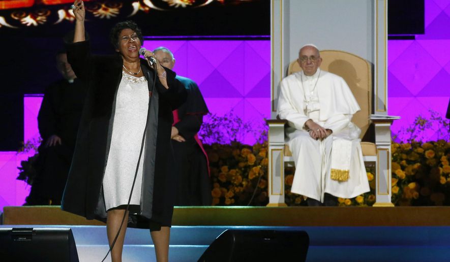 American singer Aretha Franklin sings as Pope Francis and others listen during the World Meeting of Families festival in Philadelphia, Saturday, Sept. 26, 2015. (Tony Gentile/Pool Photo via AP)