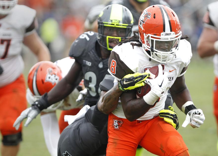 Bowling Green's Travis Greene runs for a touchdown with nine seconds remaining in the game to defeat Purdue 35-28 in an NCAA college football game Saturday, Sept. 26, 2015, in West Lafayette, Ind. (John Terhune /Journal & Courier via AP) MANDATORY CREDIT; NO SALES; LOCAL TV OUT; LOCAL RADIO OUT; LOCAL INTERNET OUT