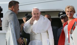 Pope Francis waves to the hundreds of faithful who came to see him off as he prepares to depart John F. Kennedy International Airport on Saturday, Sept. 26, 2015 in New York. Pope Francis will spend the last two of his six days in the U.S. in Philadelphia.  (John Paraskevas/Newsday via AP, Pool)