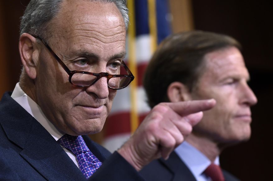 File-This May 7, 2015, file photo shows Sen. Charles Schumer, D-N.Y., left, accompanied by Sen. Richard Blumenthal, D-Conn., calling on a reporter during a news conference on Capitol Hill in Washington. Schumer, says in a statement released early Sunday, Sept. 27, 2015, that the Federal Trade Commission, which is reviewing its regulations on eyeglasses, should require eyecare providers to give complete eyeglass prescription information to consumers. Schumer says consumers could then use this information to shop around for the best deals on glasses. Schumer is also calling for the FTC to require eyecare providers to verify information about a prescription to third-party sellers in a reasonable amount of time. (AP Photo/Susan Walsh, File)