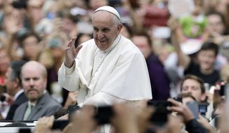 Pope Francis acknowledges faithful as he parades on his way to celebrate Mass Sunday, Sept. 27, 2015, in Philadelphia. (AP Photo/Matt Rourke, Pool) **FILE**