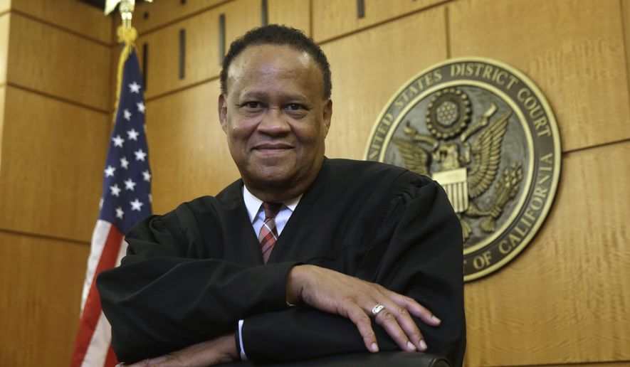 In this Thursday, Sept. 24, 2015 photo, Federal Court Judge Morrison England, Jr., the chief district judge for the Eastern District of California, poses at the Robert T. Matsui United States Courthouse in Sacramento, Calif. With an unfilled judicial vacancy and the same number of judicial positions, six, it had in 1978, the Eastern District is among many federal district courts that have seen a rise in recent years in the time it takes to resolve civil and criminal cases as judges' workloads increase. (AP Photo/Rich Pedroncelli)