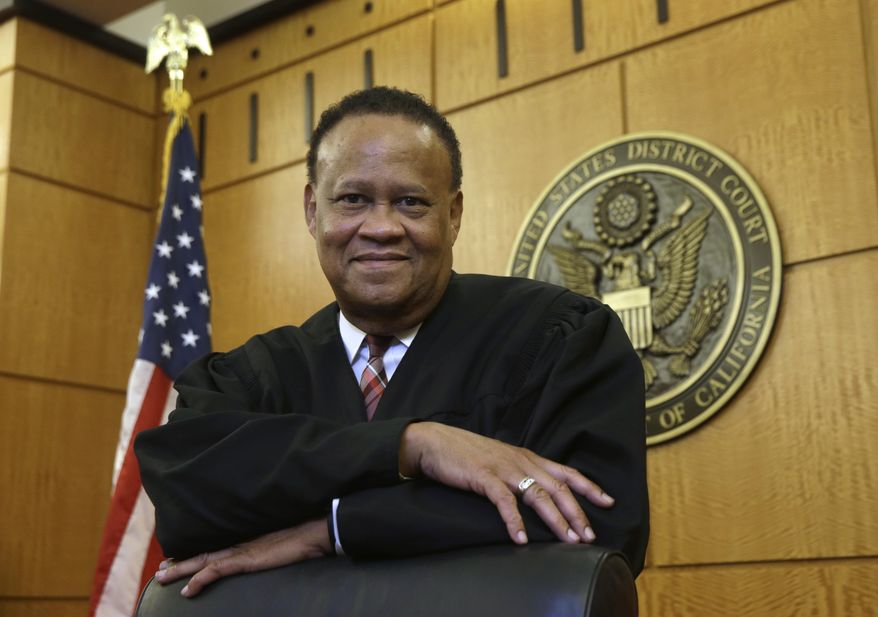 In this Thursday, Sept. 24, 2015 photo, Federal Court Judge Morrison England, Jr., the chief district judge for the Eastern District of California, poses at the Robert T. Matsui United States Courthouse in Sacramento, Calif. With an unfilled judicial vacancy and the same number of judicial positions, six, it had in 1978, the Eastern District is among many federal district courts that have seen a rise in recent years in the time it takes to resolve civil and criminal cases as judges' workloads increase. (AP Photo/Rich Pedroncelli)