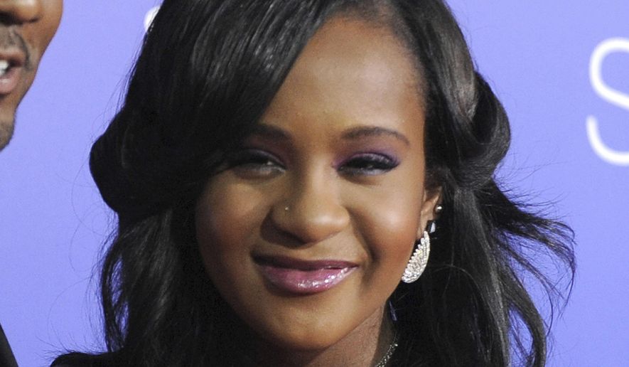 FILE - In this Aug. 16, 2012, file photo, Bobbi Kristina Brown attends the Los Angeles premiere of "Sparkle" at Grauman's Chinese Theatre in Los Angeles. The cause of Bobbi Kristina Brown’s death has been determined, but the medical examiner’s office won’t publicly unveil autopsy results because of a court order, Sunday, Sept. 27, 2015.(Photo by Jordan Strauss/Invision/AP, File)