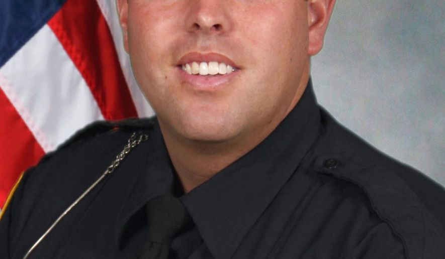 Akron Patrol Division Officer Justin Winebrenner is seen in an undated photo provided by the Akron Police Department. Winebrenner was killed in November 2014 at an East Akron Pub. Kenan Dason Ivery, 36, who trial starts Monday, Sept. 28, 2015, is facing multiple aggravated murder charges in an 18-count capital indictment. He could get the death penalty if he is convicted of any of the murder charges. (Akron Police Department/Akron Beacon Journal via AP)