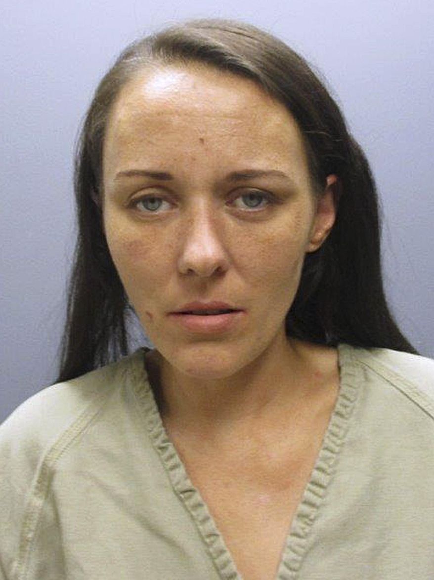 This booking photograph provided by the Franklin County, Ohio, Sheriff's Department shows Erica Maria Barley, charged with involuntary manslaughter and child endangering after authorities said her young daughter died from ingesting heroin. Barley pleaded not guilty Monday, Sept. 28, 2015, in Franklin County court and was allowed to remain free on a $15,000 bond. If convicted, she faces up to 11 years in prison. (Franklin County Sheriff's Department via AP)