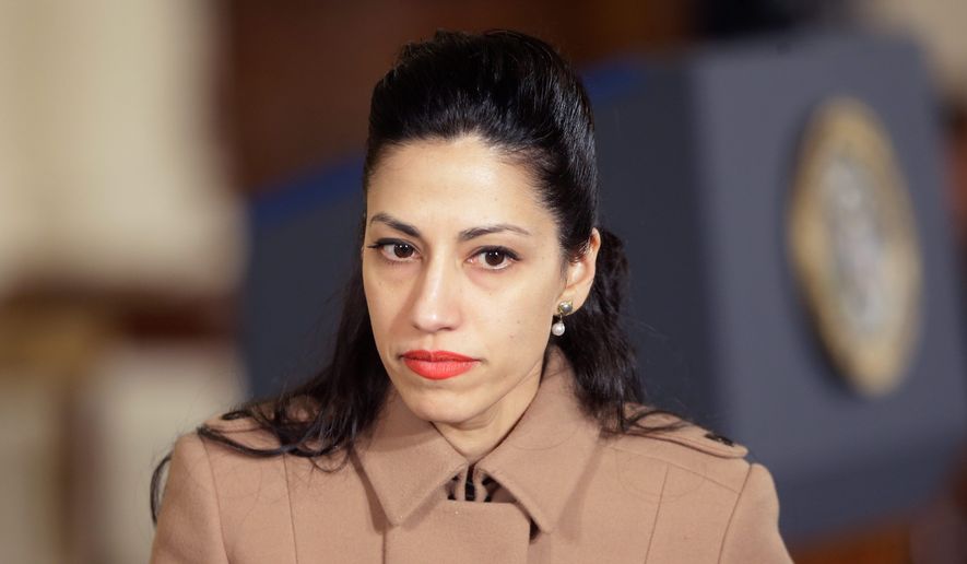 Huma Abedin, long-time aide of former Secretary of State Hillary Rodham Clinton, was paid by a private firm to help stage an event with former President Bill Clinton. (Associated Press)
