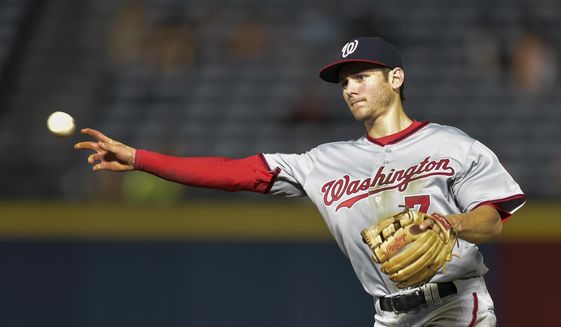 Washington Nationals second baseman Trea Turner (7) throws to first base for an out on Atlanta Braves&#39; Nick Swisher during the third inning of a baseball game, Wednesday, Sept. 30, 2015, in Atlanta. (AP Photo/Jon Barash) **FILE**