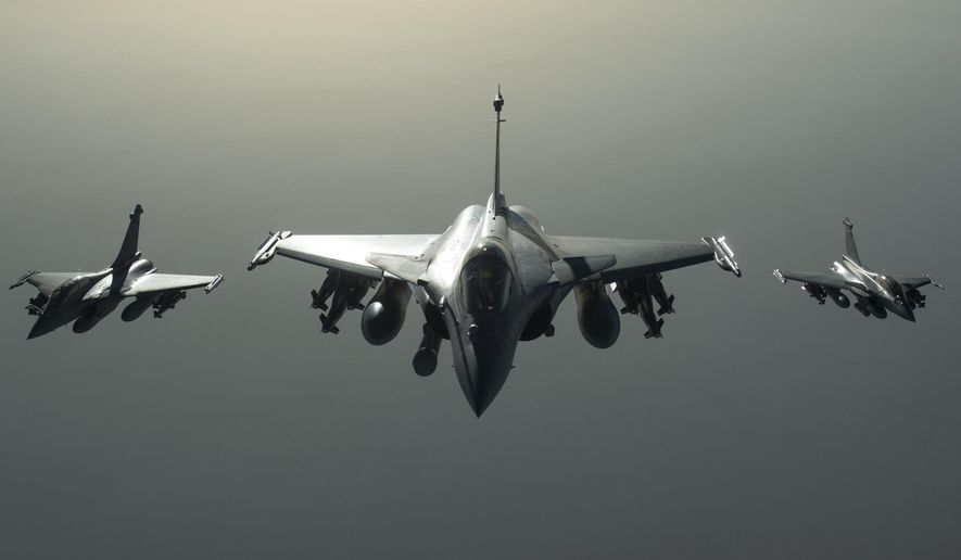 This photo released on Sunday, Sept. 27, 2015 by the French Army Communications Audiovisual office (ECPAD) shows French army Rafale fighter jets flying towards Syria as part of France&#x27;s Operation Chammal launched in September 2015 in support of the US-led coalition against Islamic State group. Six French jet fighters targeted and destroyed an Islamic State training camp in eastern Syria in a five-hour operation on Sunday, President Francois Hollande announced, making good on a promise to go after the group that he has said is planning attacks against several countries, including France. (French Army/ECPAD via AP) THIS IMAGE MAY ONLY BE USED FOR 30 DAYS FROM TIME TRANSMISSION.