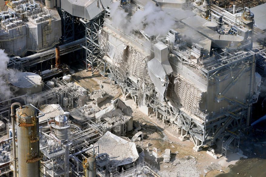 FILE - This Feb. 18, 2015 file photo shows a structure damaged after an explosion in a processing facility at the Exxon Mobil refinery in Torrance, Calif. PBF Energy Inc. announced Wednesday, Sept. 30, 2015 that Exxon Mobil is selling its troubled Southern California refinery for $537 million to a New Jersey energy company. Torrance plant is expected to close next year.The refinery has been shut down since an explosion in February injured four contractors and caused heavy damage. (Brad Graverson/Daily Breeze via AP, File)