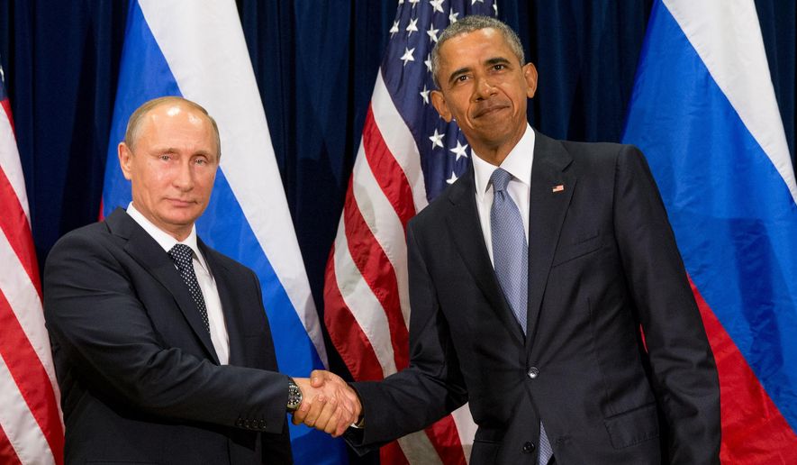 United States President Barack Obama, right, and Russia&#39;s President President Vladimir Putin pose for members of the media before a bilateral meeting Monday, Sept. 28, 2015, at United Nations headquarters. (AP Photo/Andrew Harnik)