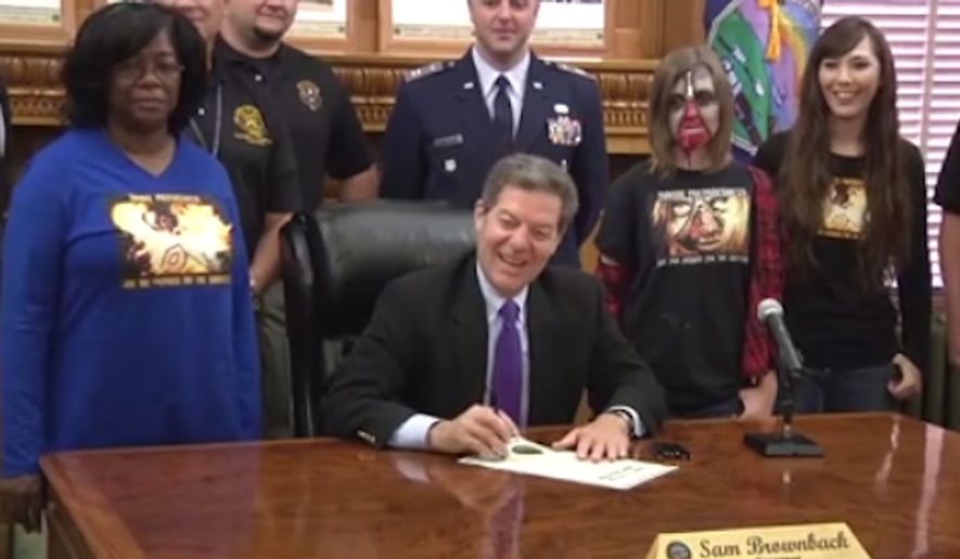 Kansas Gov. Sam Brownback signed a proclamation Wednesday officially making October &quot;Zombie Preparedness Month,&quot; as a fun way to get Kansans ready for natural disasters. (Facebook/@Kansas Division of Emergency Management)