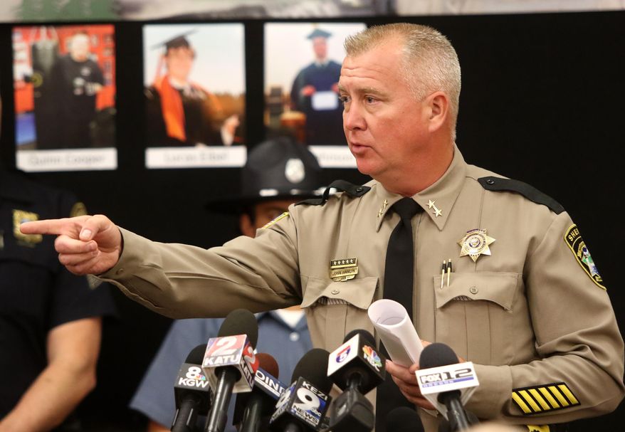 Douglas County Sheriff John Hanlin addresses the media during a news conference Friday, Oct. 2, 2015, in Roseburg, Ore, regarding the deadly shooting at at Umpqua Community College. (Michael Sullivan/The News-Review via AP) MANDATORY CREDIT