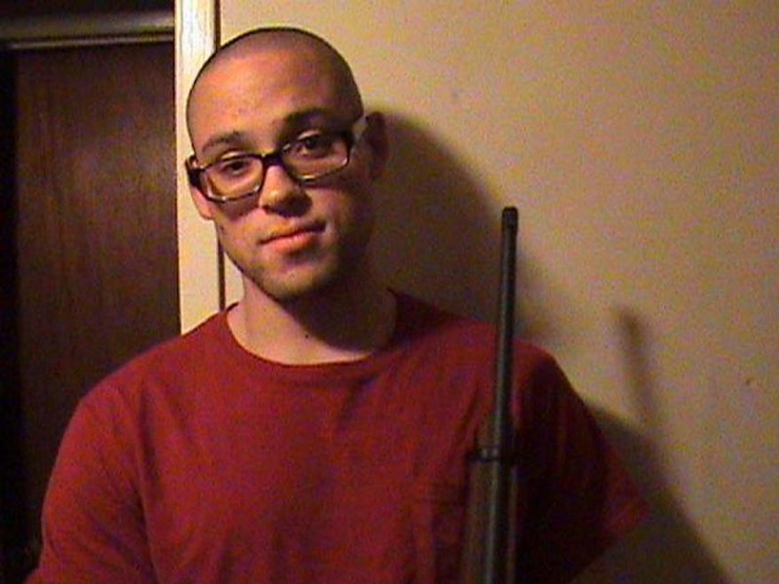 This undated photo from a MySpace page that appeared to belong to Chris Harper Mercer shows him holding a rifle. Authorities identified Mercer as the gunman who went on a deadly shooting rampage at Umpqua Community College in Roseburg, Ore., on Thursday, Oct. 1, 2015. (MySpace via AP Photo)