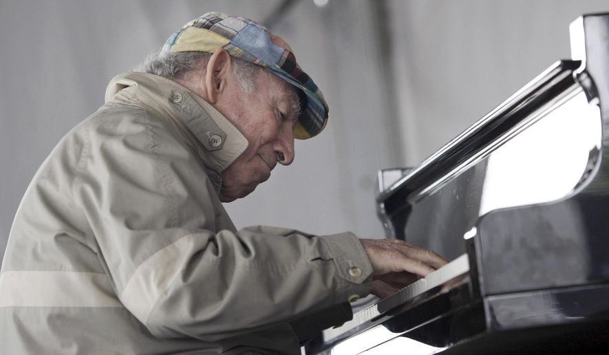 FILE - In this Aug. 9, 2009 file photo, Newport Jazz Festival founder George Wein performs during a session with Christian McBride at the festival in Newport, R.I. On the eve of his 90th birthday, Wein took the stage Friday, Oct. 2, 2015 at Dizzy's Club Coca-Cola at Jazz at Lincoln Center to play piano and sing an original blues he had written for the occasion.(AP Photo/Joe Giblin, File)