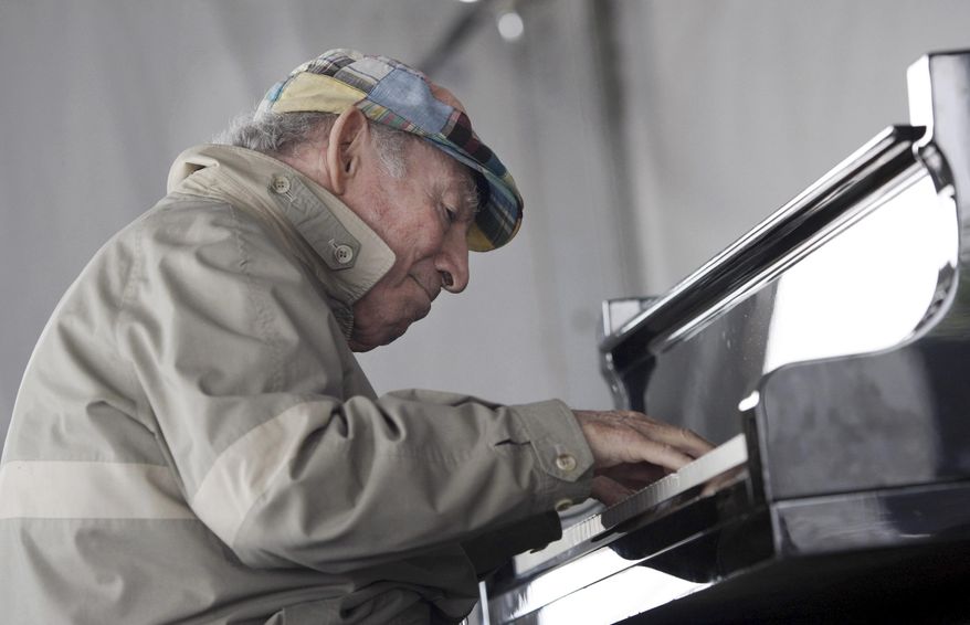 FILE - In this Aug. 9, 2009 file photo, Newport Jazz Festival founder George Wein performs during a session with Christian McBride at the festival in Newport, R.I. On the eve of his 90th birthday, Wein took the stage Friday, Oct. 2, 2015 at Dizzy's Club Coca-Cola at Jazz at Lincoln Center to play piano and sing an original blues he had written for the occasion.(AP Photo/Joe Giblin, File)