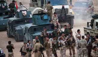 Kurdish peshmerga troops are taking back territory in northern Iraq in a survivalist fight against Islamic State invaders who have commandeered hundreds of American vehicles. The Kurdish forces say they are outgunned and need armor-piercing projectiles. (Associated Press photographs)