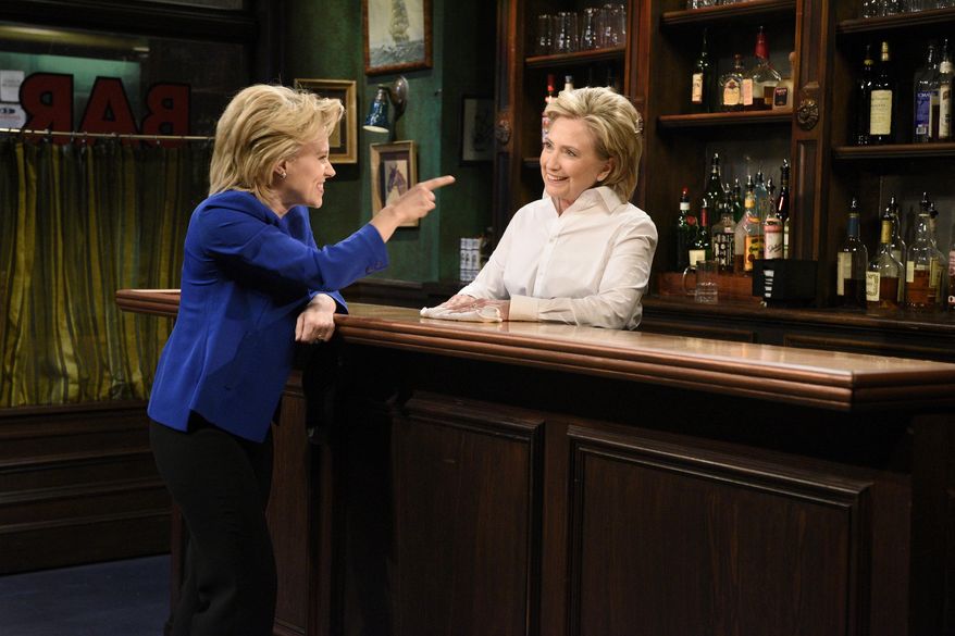 In this Saturday, Oct. 3, 2015, photo, provided by NBC, Kate McKinnon, left, portraying Hillary Rodham Clinton, and Hillary Rodham Clinton, right, portraying Val, appear during the "Bar Talk" sketch on "Saturday Night Live," in New York. Most political candidates play themselves on "SNL," often for just a cameo in a sketch or to declare the show's famous tag line, "Live from New York, it's Saturday night!" Seldom do they play a character in a sketch, as did Clinton. (Dana Edelson/NBC via AP)