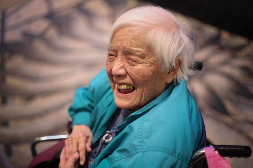 In this Feb. 25, 2014, photo, long-time activist Grace Lee Boggs speaks to a crowd gathered for the Environmental Grantmakers Association conference in Detroit. Boggs, known as an international activist for justice, has died at her Detroit home. She was 100. (Ryan Garza/Detroit Free Press via AP) DETROIT NEWS OUT; TV OUT; MAGS OUT; NO SALES; MANDATORY CREDIT DETROIT FREE PRESS