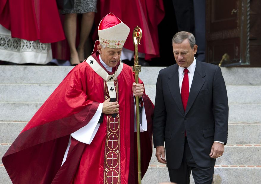 Cardinal Donald Wuerl, archbishop of Washington, walk with U.S. Supreme Court Chief Justice John Roberts as they leave the church, after the Red Mass at St. Matthews Cathedral in Washington on Sunday, Oct. 4, 2015. The Supreme Court's new term starts Monday, Oct. 5. ( AP Photo/Jose Luis Magana)