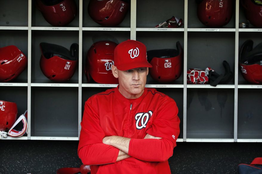 Washington Nationals manager Matt Williams (9) pauses in the dugout before a baseball game against the Philadelphia Phillies at Nationals Park, Friday, May 22, 2015, in Washington. (AP Photo/Alex Brandon)