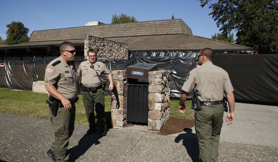 Sheriff&#39;s deputies stand in front of Snyder Hall at Umpqua Community College, Monday, Oct. 5, 2015, in Roseburg, Ore. The campus reopened on a limited basis for faculty and students for the first time since armed suspect Chris Harper-Mercer killed multiple people and wounded several others on Thursday before taking his own life at Snyder Hall. (AP Photo/John Locher)