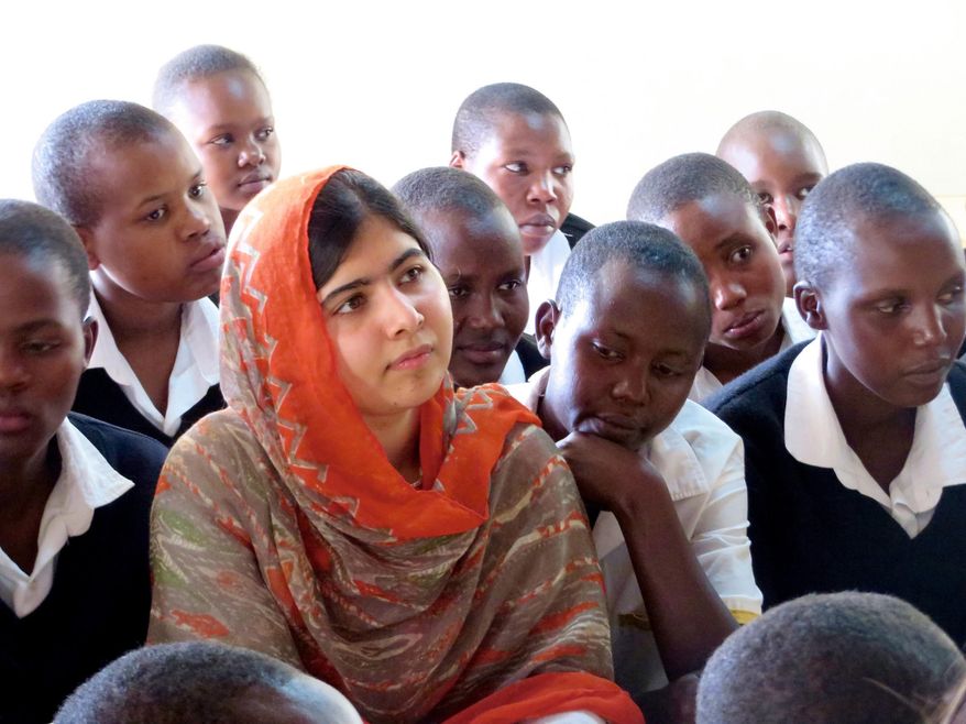 This May 26, 2014 photo provided by courtesy of Fox Searchlight Pictures shows, Malala Yousafzai, second left, at the Kisaruni Girls School in Massai Mara, Kenya. Yousafzai is the subject of the documentary film, "He Named Me Malala." (Fox Searchlight Pictures via AP)