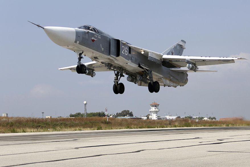 In this photo taken from Russian Defense Ministry official web site on Tuesday, Oct. 6, 2015, a Russian SU-24M jet fighter takes off from an airbase Hmeimim in Syria. (Russian Defense Ministry Press Service via AP) ** FILE **
