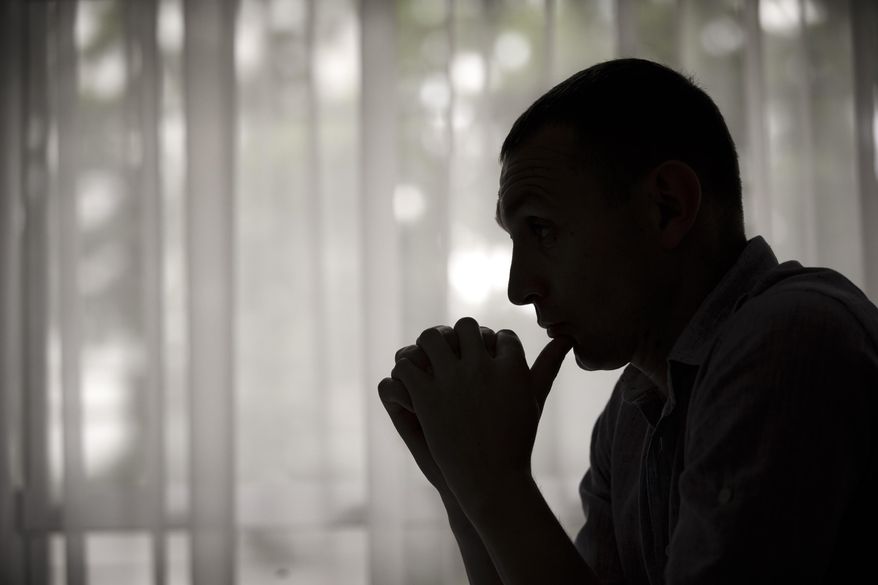 In this May 27, 2015 photo, former Moldovan police investigator Constantin Malic pauses during an interview in Chisinau, Moldova. In 2009, Malic was a 27-year-old police officer when he first stumbled upon the nuclear black market. He was working on a fraud unit in the Moldovan capital, and had an informant helping police take down a euro counterfeiting ring stretching from the Black Sea to Naples, Italy. The informant, a businessman in his fifties, casually mentioned to Malic that over the years, contacts had periodically offered him radioactive material. (AP Photo/Vadim Ghirda)