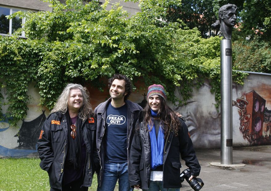 FILE - In this June 4, 2009 file photo, the family of late musician Frank Zappa, wife Gail, from left, son Dweezil and daughter Diva, stand near by the Frank Zappa statue, in Vilnius, Lithuania. Gail Zappa, has died at her Los Angeles home at age 70. Family spokeswoman Marcee Rondan says Zappa was surrounded by her children when she died Wednesday, Oct. 7, 2015. (AP Photo/Mindaugas Kulbis, File)