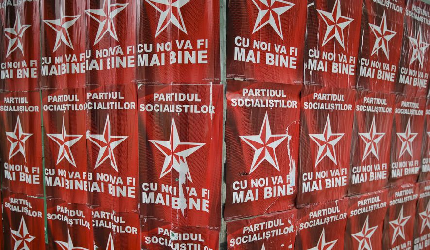 This May 28, 2015 photo shows a wall of electoral banners for the Socialist Party in Chisinau, Moldova. Multiple Moldovan police and judicial authorities say a breakdown in cooperation between Russia and the West means that it is much harder to know whether smugglers are finding ways to move parts of Russia&#39;s vast store of radioactive materials. (AP Photo/Vadim Ghirda)