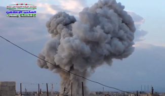 This image taken from video provided by the Syrian activist-based media group Syrian Revolutionary Command Council in Hama, which has-been verified and is consistent with other AP reporting, shows smoke rising after a Russian airstrike hit buildings in the town of Latamna in the area of Hama in Eastern Syria, Wednesday, Oct. 7, 2015. (Syrian Revolutionary Command Council in Hama via AP Video) MANDATORY CREDIT