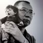 RETRANSMISSION TO ADD COLUMBIA UNIVERSITY - This Tuesday, Feb. 7 2012 photo shows 2010 Nobel Peace Prize winner Liu Xiaobo holding a doll in a detail of a photograph by his wife, Chinese artist Liu Xia on display at during a preview of &quot;The Silent Strength of Liu Xia&quot; exhibit at The Italian Academy in Columbia University in New York. The photos were spirited out of China just before Liu was placed under house arrest after her husband, imprisoned in 2009 for urging democratic reform, won the Nobel. Her works are censored in her native country. The exhibition opens Thursday, Feb. 9, 2012. (AP Photo/Mary Altaffer) **FILE**