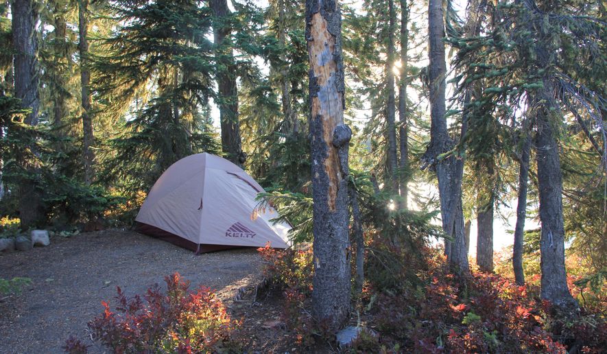 ADVANCE FOR WEEKEND EDITIONS, OCT. 10-11 - This photo taken Sept. 8, 2015, shows a camping spot on Berry Island on Summit Lake in the Deschutes National Forest near Oakride, Ore. Summit Lake is one of the great secret places in the Cascade Mountains not just because of its islands, but also because of the clear water and views of Diamond Peak. (Zach Urness/Statesman-Journal via AP) MANDATORY CREDIT