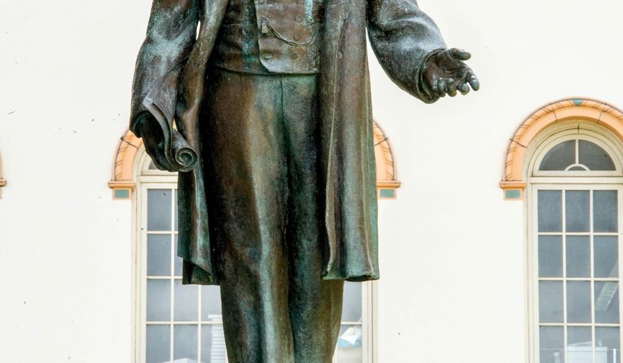 ADVANCE FOR SUNDAY OCT. 11, 2015, AND THEREAFTER - In this photo taken Sept. 23, 2015, a statue of President William McKinley stands in front of McKinley High School in Honolulu. In 150 years McKinley has stood through wartime and storms, triumph and tragedy, challenges and crises. Its alumni roster rivals that of top prep schools. The campus architecture is among the most beautiful of any Hawaii school. (Craig T. Kojima/The Star-Advertiser via AP) MANDATORY CREDIT