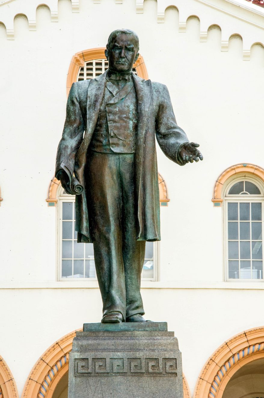 ADVANCE FOR SUNDAY OCT. 11, 2015, AND THEREAFTER - In this photo taken Sept. 23, 2015, a statue of President William McKinley stands in front of McKinley High School in Honolulu. In 150 years McKinley has stood through wartime and storms, triumph and tragedy, challenges and crises. Its alumni roster rivals that of top prep schools. The campus architecture is among the most beautiful of any Hawaii school. (Craig T. Kojima/The Star-Advertiser via AP) MANDATORY CREDIT